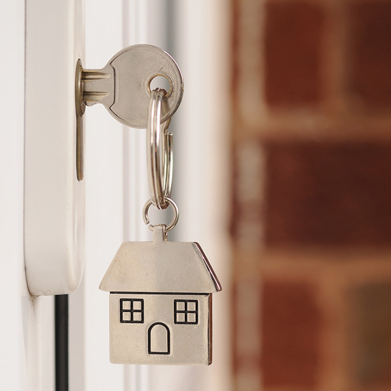 Key in holiday home door signifying access for inspections