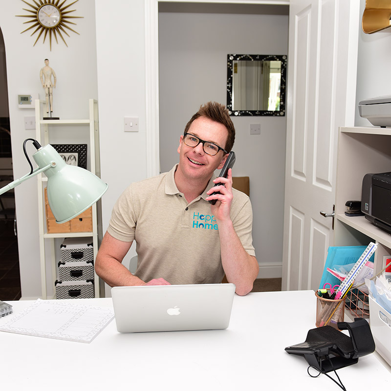 Man working on computer for admin managment of holiday properties